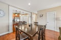 Gather around this spacious dining table where your group can share meals and stories together. The open layout flows seamlessly into the kitchen, making it easy to cook, serve, and enjoy quality time with loved ones.