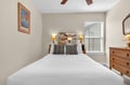 Drift off to sleep in your cozy bedroom, complete with warm lighting and thoughtful vintage touches.