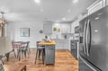 Cook memorable meals in your modern kitchen, featuring stainless steel appliances, marble countertops, and a cozy breakfast island perfect for morning coffee.