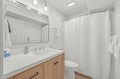 Step into your fresh, bright bathroom with modern fixtures, crisp white finishes, and plush towels ready for your arrival—everything you need to feel right at home.