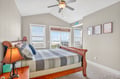 Wake up to stunning water views from your comfortable bedroom with coastal breezes from the ceiling fan.