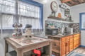 Your rustic kitchen blends charm with convenience—whip up morning coffee or prepare hearty meals using quality appliances and warm wood finishes.