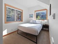 Wake up to garden views from your cozy bedroom with modern comfort and warm natural light streaming through.
