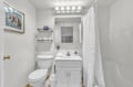 Freshen up in your private bathroom with crisp white linens, bright lighting, and thoughtful storage for all your essentials.