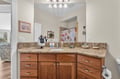 Your spacious bathroom vanity features granite counters, warm wood cabinetry, and ample storage for all your vacation essentials.