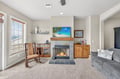 Cozy up in your spacious living room with crackling fireplace, comfortable seating, and charming touches that make this feel like home.