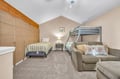 Your spacious bedroom offers flexible sleeping with a cozy single bed, bunk beds, and plush sectional sofa for lounging.