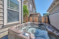 Soak away your stress in your private hot tub, perfectly positioned in this secluded outdoor space for ultimate relaxation.