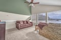 Unwind in your spacious living room with vaulted ceilings, comfortable seating, and stunning waterfront views through large windows.