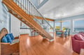 Stunning open-concept living space with gleaming hardwood floors and soaring ceilings. Relax in your spacious retreat with breathtaking views.