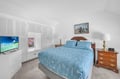 Rest in comfort with a soft bed, tropical TV views, and ample storage for your stay.