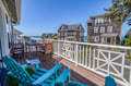 Step outside onto your private balcony and breathe in the salt air. Relax in bright turquoise Adirondack chairs with an ocean view. Perfect for morning coffee or sunset cocktails.
