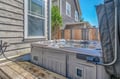 Unwind in your private hot tub oasis, perfectly positioned on the deck for ultimate relaxation under blue skies.