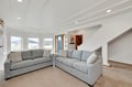 Sink into plush sectional seating in your bright living space, where exposed ceiling beams and mountain views create the perfect spot to unwind.