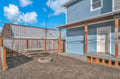 Your private backyard features a fire pit, picnic table, and elevated deck - perfect for evening gatherings under the open sky.
