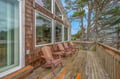Unwind in these classic Adirondack chairs on your private deck, surrounded by towering trees and peaceful coastal charm.