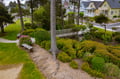 Charming coastal neighborhood with colorful Victorian homes and well-maintained gardens creating a peaceful residential setting.