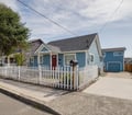 Wide exterior showing Main Cottage, detached Surf Shack, Game Room, and driveway.