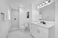 Step into your pristine bathroom featuring a spacious walk-in shower with subway tiles, elegant vanity, and abundant natural light streaming through the window.