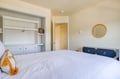 Sink into crisp linens and wake up refreshed in your serene bedroom with ample storage and thoughtful touches throughout.