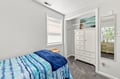 Unwind in your serene bedroom retreat with a plush bed, plenty of storage, and soft natural light for a restful night's sleep.