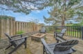 Gather around your private fire pit on this peaceful patio, where cozy Adirondack chairs invite evening conversations under towering trees.