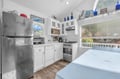 Your fully equipped kitchen makes meal prep a breeze with stainless steel appliances and charming white cabinetry.