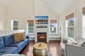 Unwind in your light-filled living room with soaring vaulted ceilings, cozy fireplace, and comfortable seating for everyone to gather and relax together.