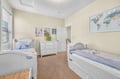 Your little ones will drift off dreaming of adventures in this charming twin bedroom, complete with world map inspiration and cozy nautical bedding.