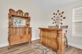 Elegant wooden furniture adds warmth to your dining space, with ornate details creating a welcoming atmosphere.
