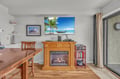 Cozy up by your personal fireplace while watching the big screen TV. The warm wood dining table is perfect for meals together.