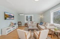 Unwind in this inviting living room with cozy seating, a smart TV for movie nights, and calming natural light to help you truly relax.