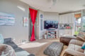 Sink into plush sectional seating while you enjoy your favorite shows on the big screen TV in this cozy living space.