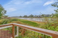 Stunning waterfront panorama from this elevated deck showcasing pristine coastline and peaceful natural surroundings.