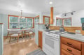 Your bright kitchen welcomes you with warm wood tones, modern appliances, and a cozy dining nook perfect for morning coffee or evening meals.