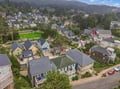 This charming coastal neighborhood nestles into forested hillsides, offering a peaceful retreat where tree-lined streets and mountain views frame the surrounding area.