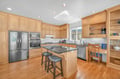 Your gourmet kitchen awaits with granite countertops, stainless steel appliances, and a breakfast bar perfect for morning coffee or casual meals.