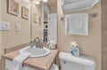 Your private bathroom features fresh towels and thoughtful amenities, creating a comfortable space to refresh after your adventures.