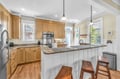 Your fully equipped kitchen features granite countertops, modern appliances, and a convenient breakfast bar perfect for morning coffee.