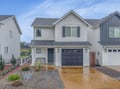 Modern two-story home with garage parking and landscaped front yard in a quiet residential neighborhood.