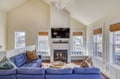 Sink into the plush sofa and feel the warmth of the fireplace as natural light pours through bamboo-shaded windows, framing your coastal getaway perfectly.