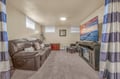 Sink into plush leather recliners and enjoy movie nights on your large screen TV in this cozy entertainment room.