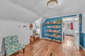 Unwind in your cozy reading nook with comfortable seating and shelves filled with books for quiet afternoons.
