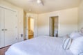 Sink into crisp linens in this peaceful bedroom with an ensuite bathroom and abundant natural light, creating a restful sanctuary for your stay.
