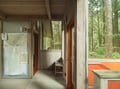 Step into your modern forest retreat where natural light floods through floor-to-ceiling windows, connecting you with serene woodland views.