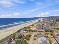 This beachside rental community sits on a picturesque stretch of sandy shoreline, with miles of coastline curving along the Pacific and rolling hills framing the horizon.