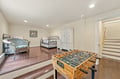 Challenge your friends to a friendly foosball match in this flexible space, which also features two comfortable beds and plenty of storage—perfect for rest and play.