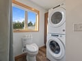 Your convenient laundry room combines modern washer and dryer with natural light, making stay-day routines effortless.