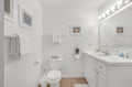 Freshen up in this bright, spotless bathroom featuring a roomy vanity, soft towels, and coastal touches—your private retreat after a day of adventures.