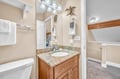 Your private bathroom features granite countertops, warm wood cabinetry, and charming turtle-themed decor that adds a playful coastal touch to your stay.